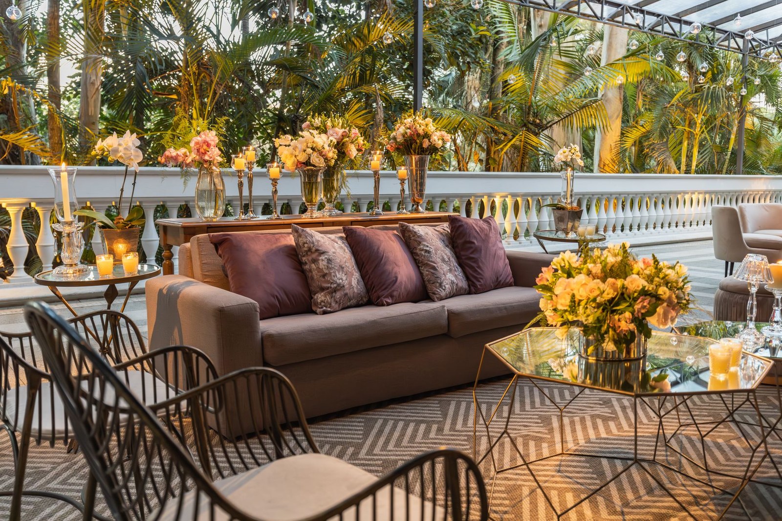 Decorated outdoor terrace with upholstered seating in commercial use