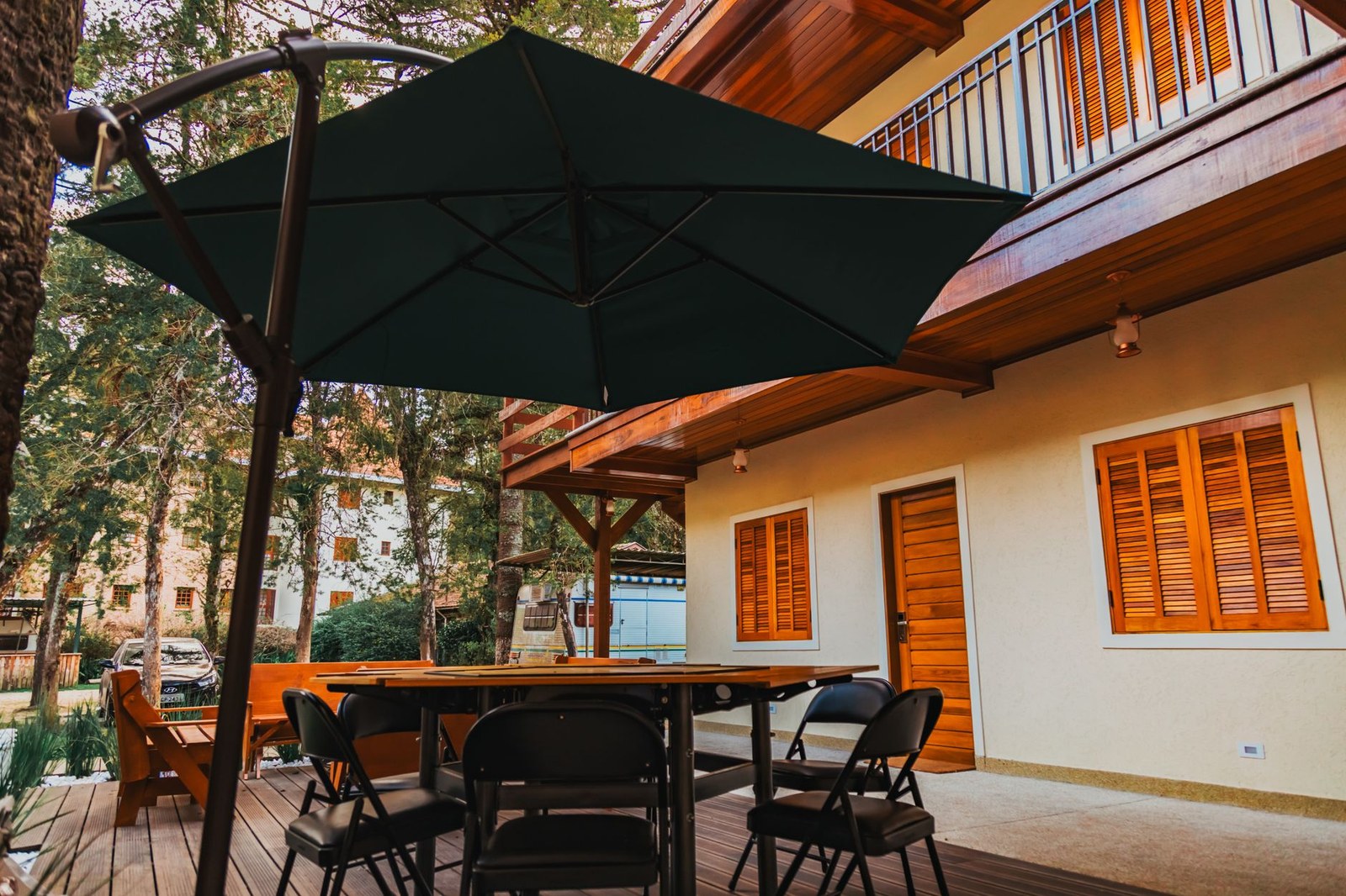 Commercial patio umbrellas on a terrace with dining tables and chairs