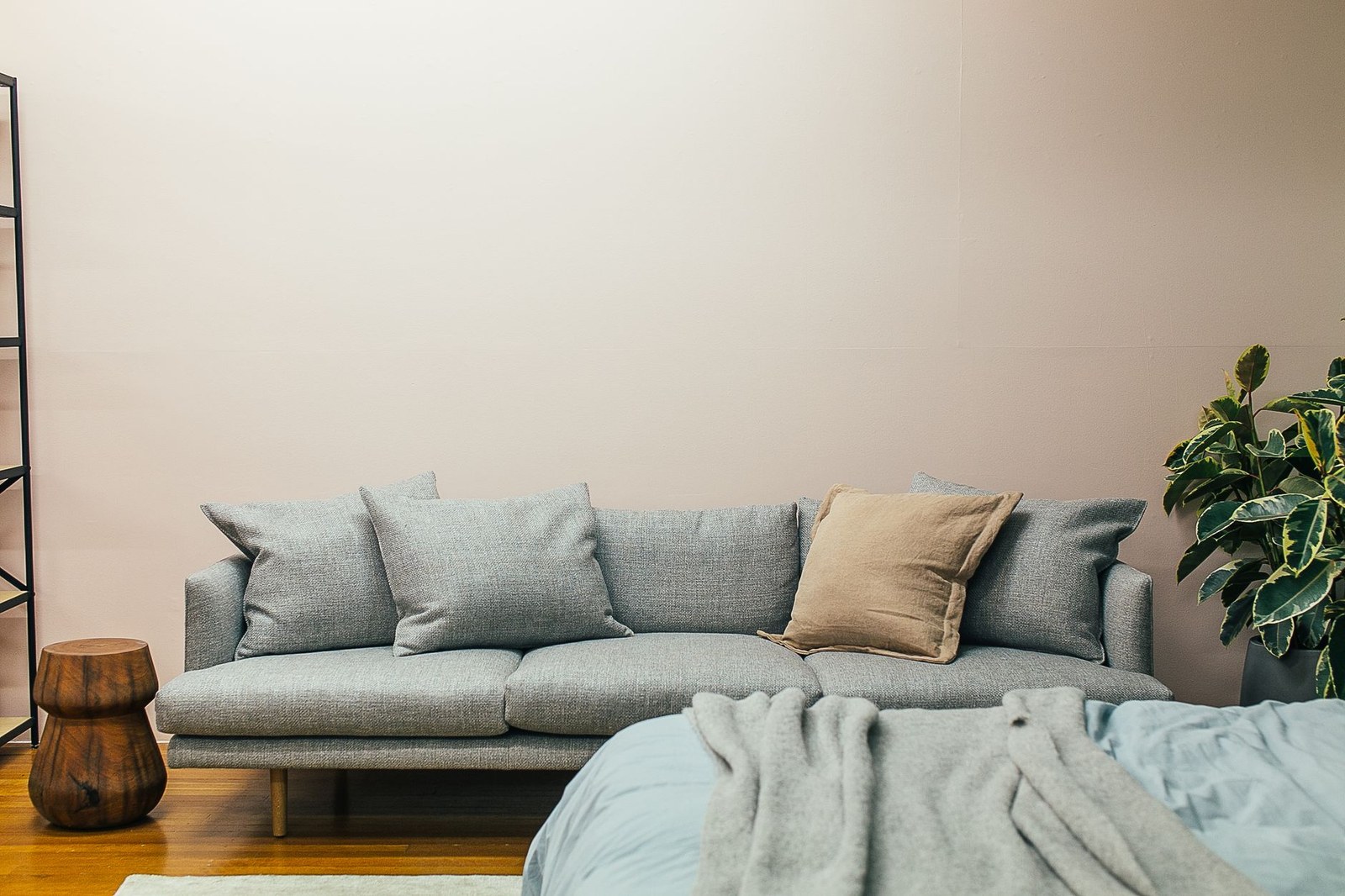 Outdoor furniture fabric and cushions: upholstered outdoor sofa with seat and back cushions on a terrace