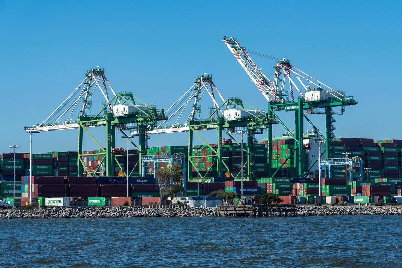 Export crates and shipping containers at a loading dock for furniture shipments